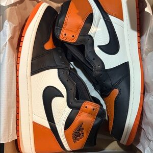 Jordan High-Top Sneakers in Black, Orange, and White